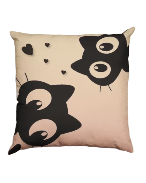 two black cats looking in front on a brown pillowcase