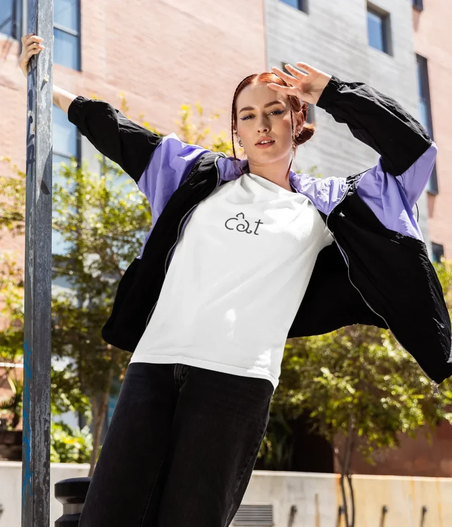 model wearing white t-shirt with cat design