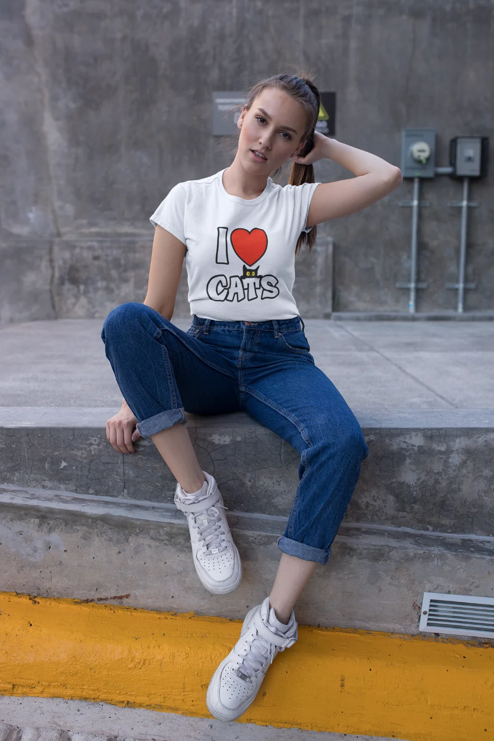 model wearing white t-shirt with black cat fun design